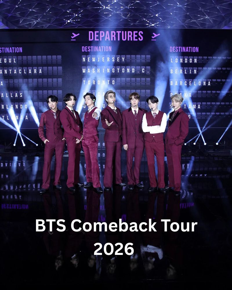 Seven BTS members in matching burgundy suits posing on a concert stage with departures board backdrop