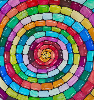 Painting of concentric circles made of colorful blocks in rainbow colors spiraling to center