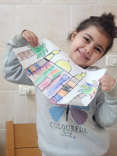 Girl Showing Colorful Drawing