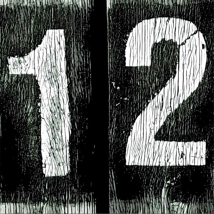 White textured numbers 1 and 2 on black weathered background