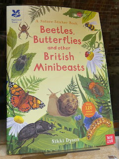 Cover of a nature sticker book about beetles, butterflies and other British minibeasts with insect illustrations
