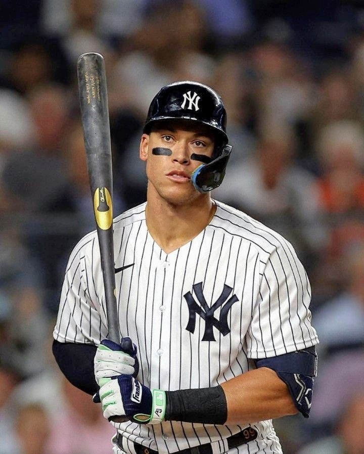 Aaron Judge in New York Yankees pinstripe uniform holding a baseball bat at the plate