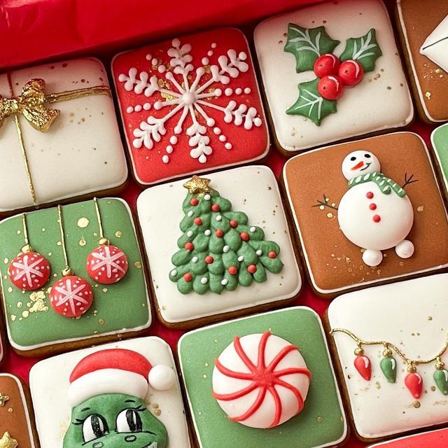 Assorted decorated Christmas cookies with snowflake, tree, snowman, Santa hat and peppermint designs
