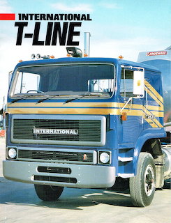 Blue International T-Line truck from 1987 parked in Australian outback with clear sky background