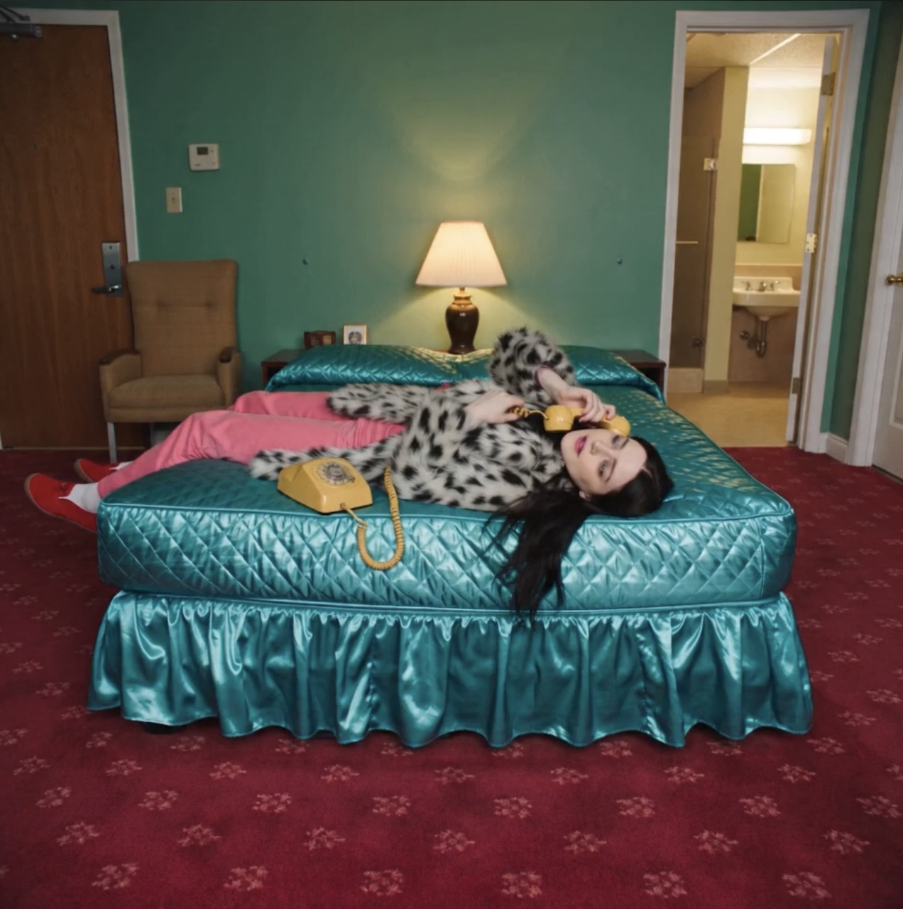 Woman Relaxing on Turquoise Bed