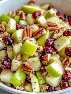 Bowl of apple salad with cranberries and pecans