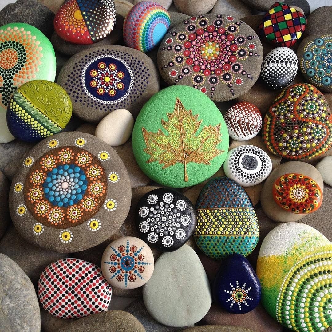 Collection of hand-painted rocks with colorful mandala and dot patterns