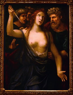 Renaissance painting of Lucretia with red hair holding a dagger, surrounded by figures in dark robes