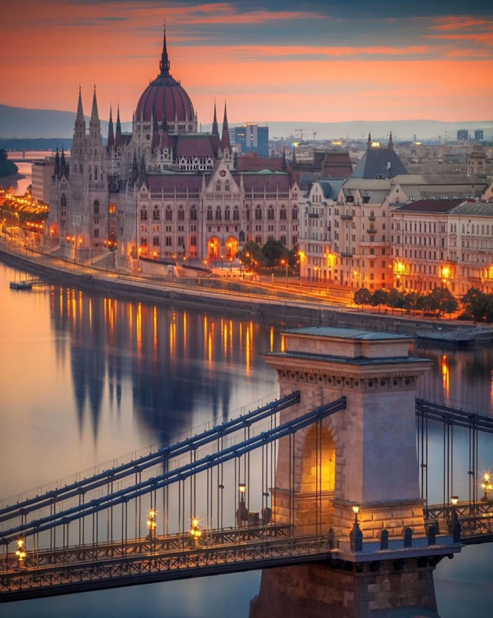 Budapest skyline at dusk with Chain Bridge over the Danube and illuminated Hungarian Parliament Building