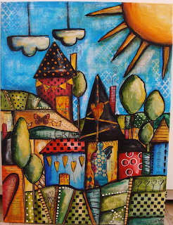 Colorful folk art painting of a whimsical village with patterned houses, trees, sun, and clouds