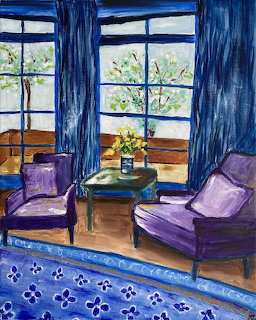 Painted living room with purple chairs, blue curtains, patterned rug, wooden table with vase, and large windows