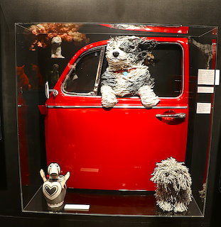Dogs in Red Car Sculpture