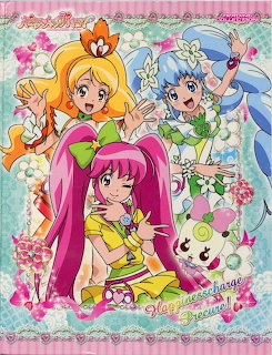 Three Happiness Charge Precure anime girls with colorful hair and outfits posing with a white mascot character