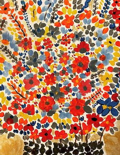 Colorful abstract painting of red, orange, blue and yellow flowers in folk art style