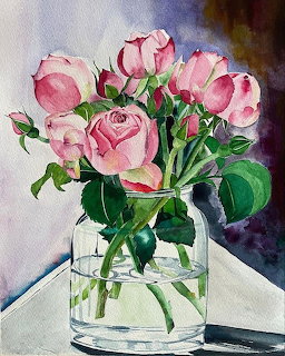 Watercolor painting of pink roses in a glass vase with green foliage