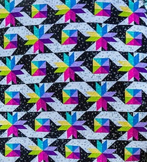 Colorful patchwork quilt with geometric fabric squares