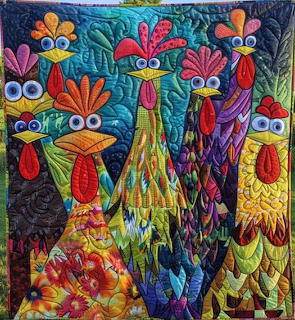Colorful quilt with stylized chickens made from patterned fabric and button eyes