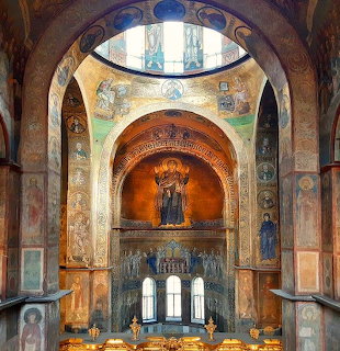 Byzantine cathedral interior with frescoes, arched dome, religious iconography, and ornate architectural details