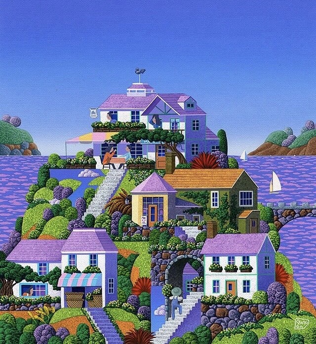Colorful painted seaside village with pastel houses on a rocky hill above purple water