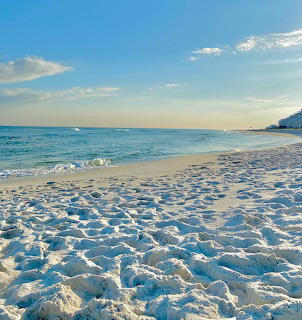 White sand beach with turquoise ocean and blue sky