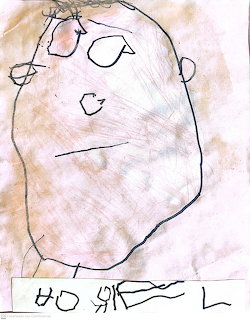 Child's crayon drawing of a face with simple features and letters below
