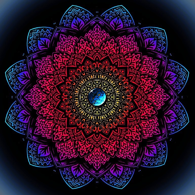 Ornate burgundy and purple mandala with turquoise center on black background