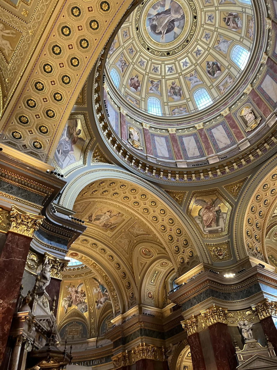Ornate golden dome and decorated ceiling inside St. Stephen's Basilica, Budapest