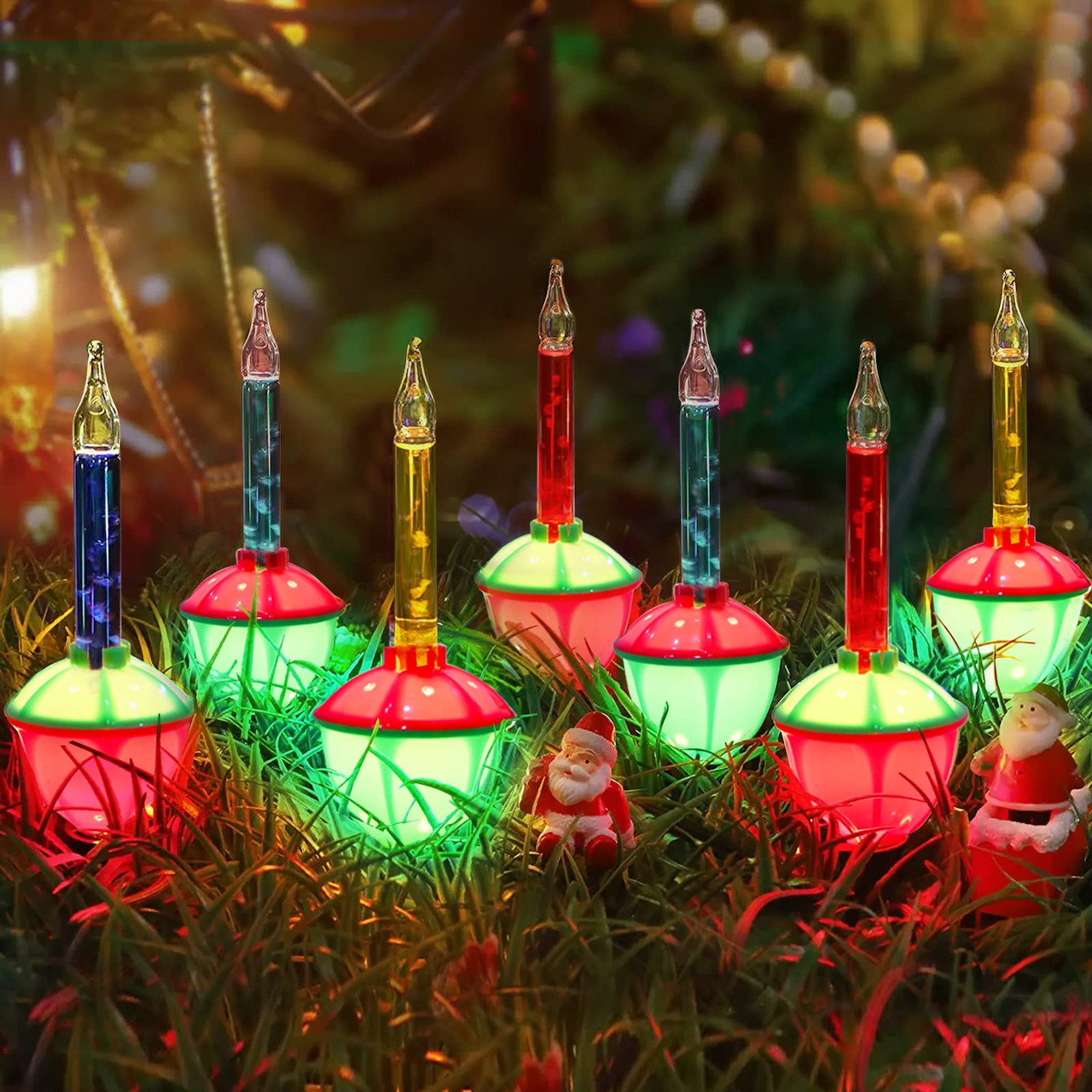 Row of vintage colorful bubble lights on Christmas tree with bokeh background