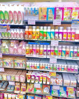 Colorful store shelves filled with tropical toiletries and Hawaiian souvenir products