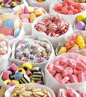 Assortment of brightly colored candies in various shapes and colors
