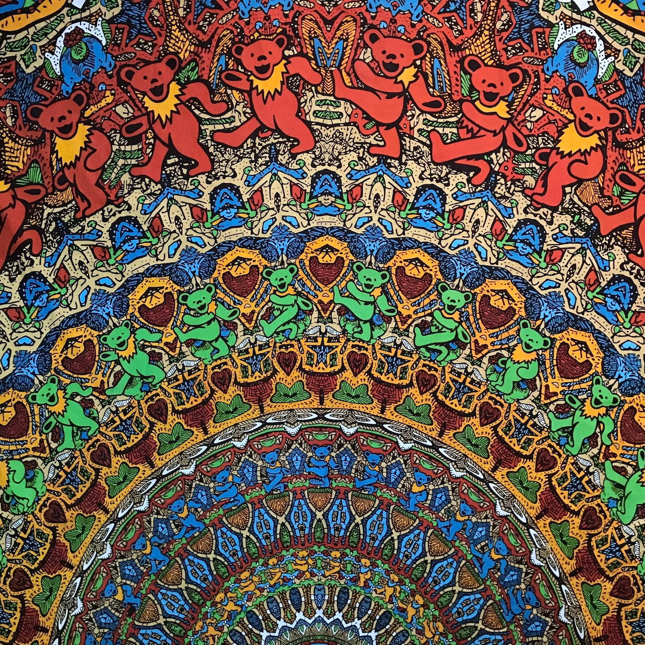 Colorful mandala with dancing bears in concentric circles surrounded by intricate floral and geometric patterns