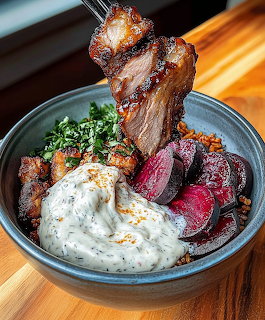 Grilled lamb chops on skewer in bowl with beets, herbs, and yogurt sauce