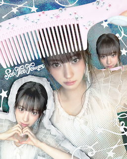 Three young women in white clothing posing together with pastel star decorations and a large comb graphic