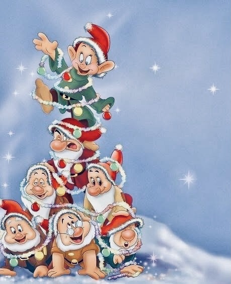 Seven Dwarfs characters stacked as Christmas tree wearing Santa hats on blue snowy background