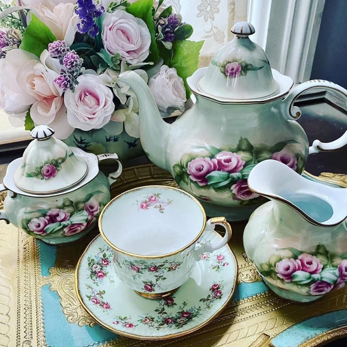 Mint green vintage tea set with pink rose floral pattern and matching fresh flowers