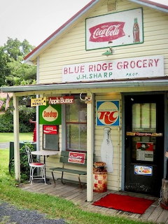 Vintage Blue Ridge Grocery store with old Coca-Cola sign, wooden porch, and retro advertising signs