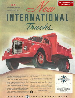 Vintage advertisement showing a red International dump truck with bold New International Trucks headline text
