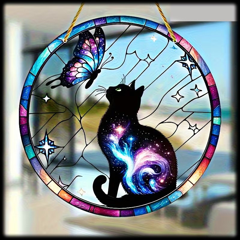 Circular sun catcher with black cat, butterfly, and colorful stained glass border against window