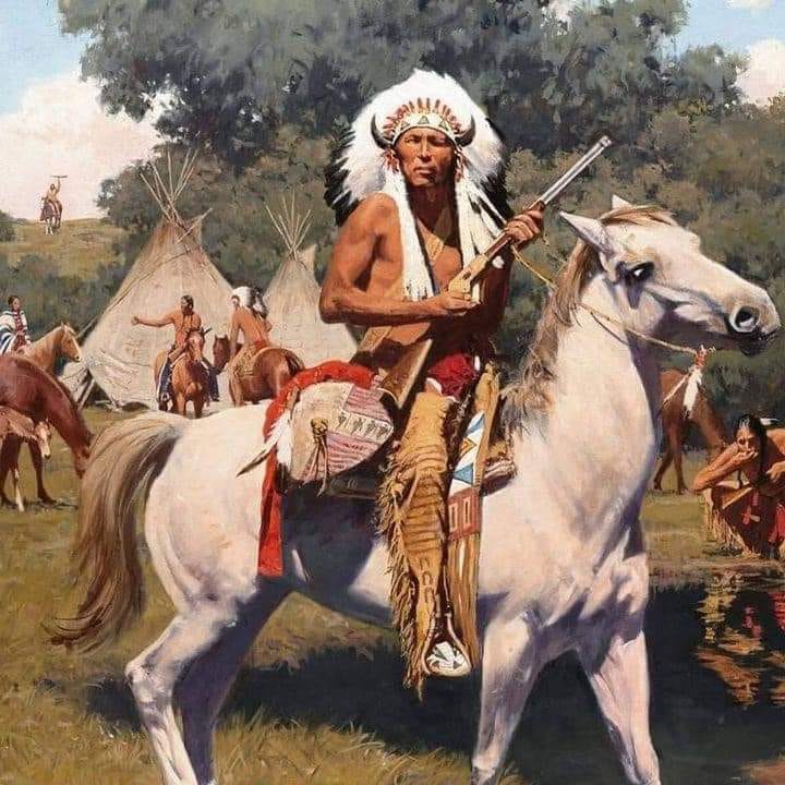 Native American warrior in headdress riding white horse, holding rifle in outdoor setting with tipis