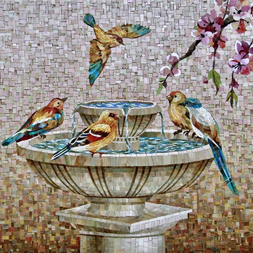 Mosaic artwork showing colorful birds on a stone fountain with pink blossoms