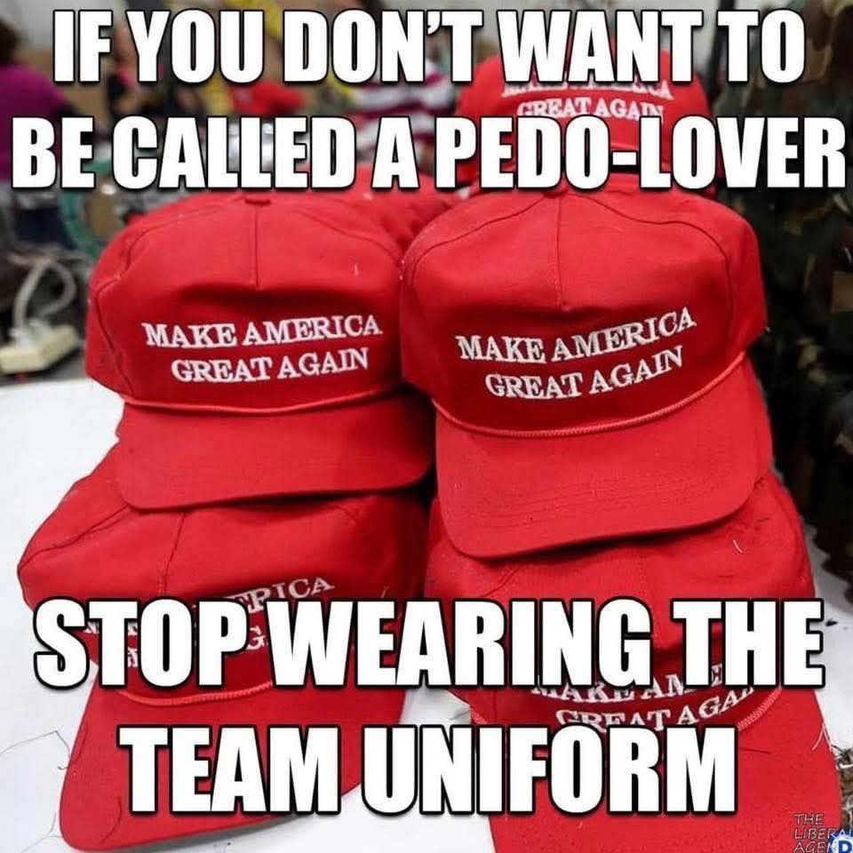 Stack of red Make America Great Again hats with large white meme text