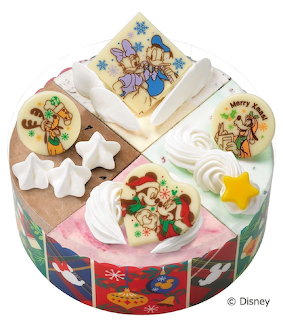 Round white frosted cake decorated with Disney characters in Christmas holiday scenes