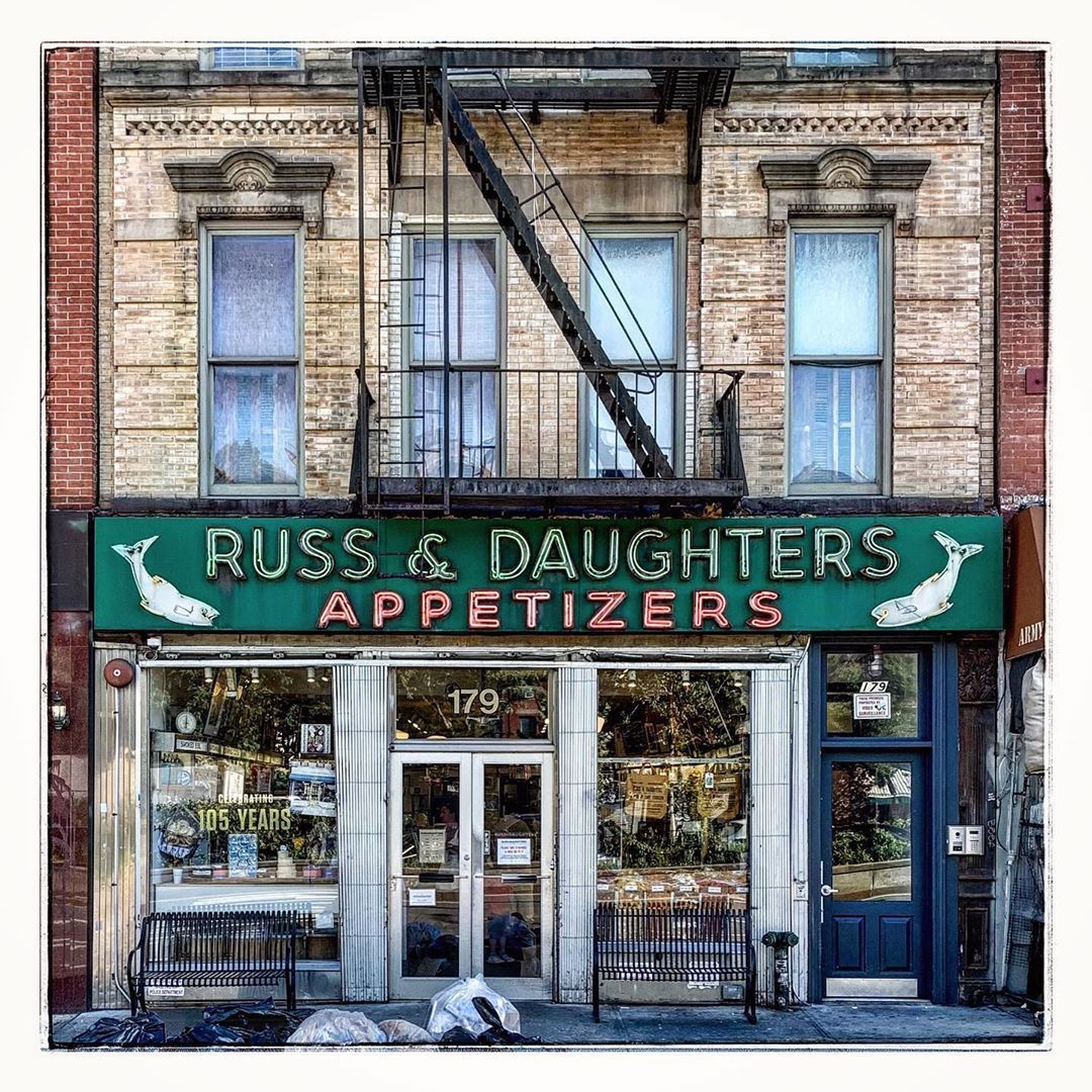 Vintage brick storefront with Russ & Daughters Appetizers sign and fire escape above