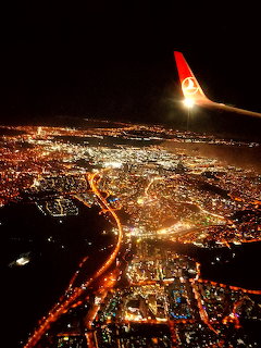 Airplane Over City
