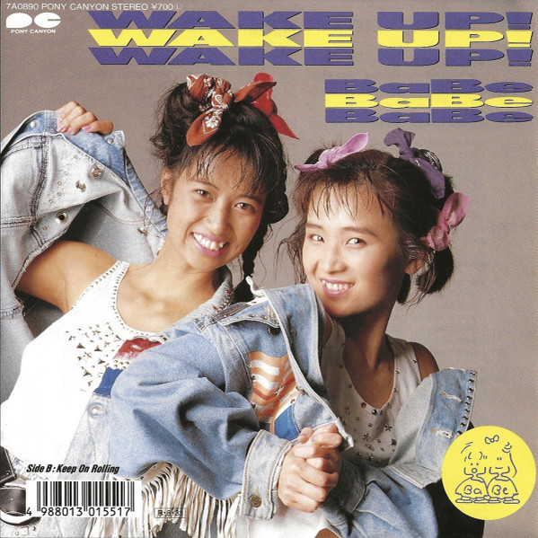 Vintage-style image of two smiling young women in denim jackets with hair bows and bold text