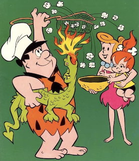 Fred Flintstone popping popcorn with dragon's fire breath while Wilma and Pebbles hold yellow bowl