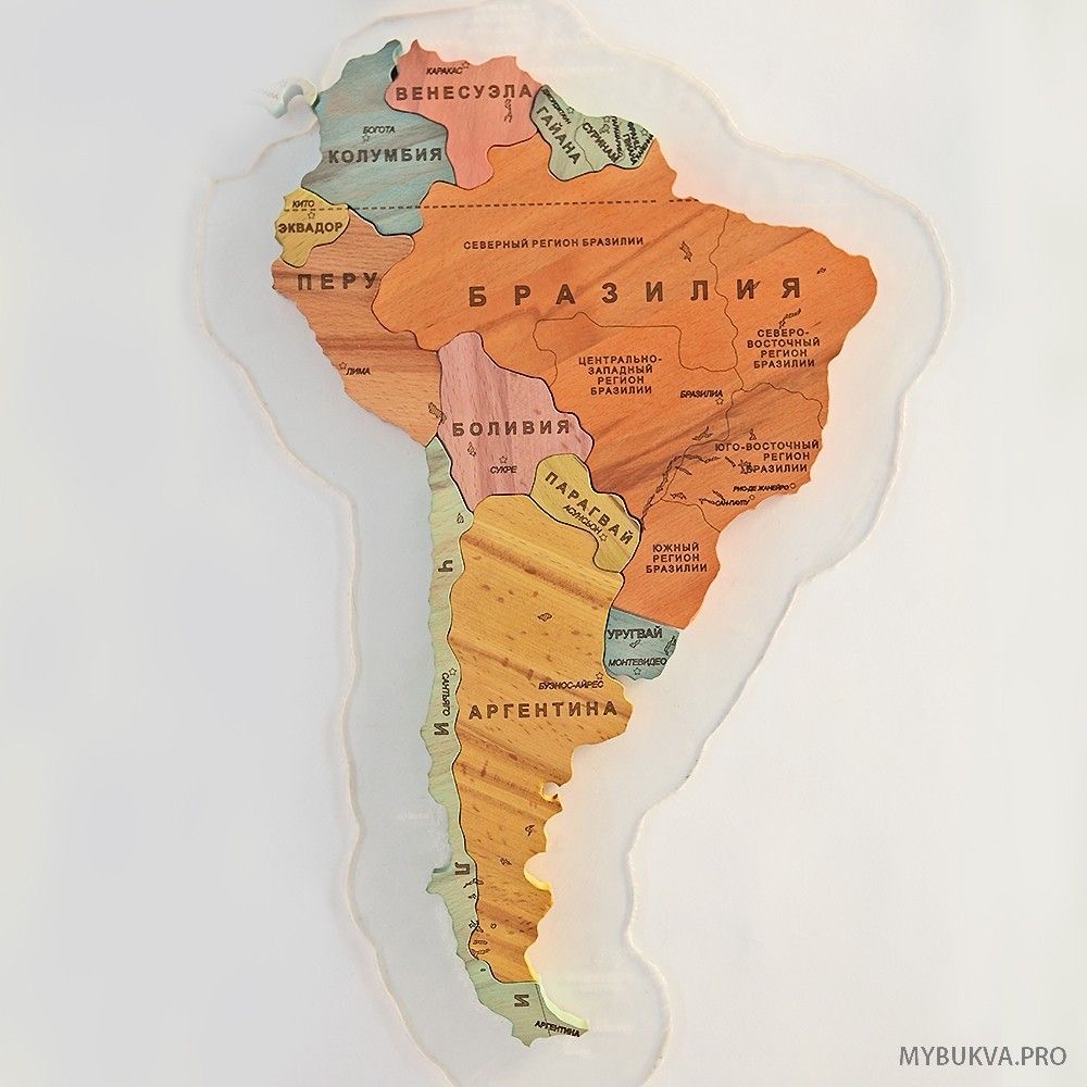 Wooden map of South America with country borders and labels on a white background