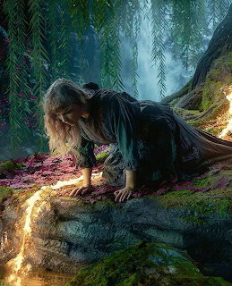 Young girl in dark dress reaching toward a glowing frog on tree roots in a magical forest scene