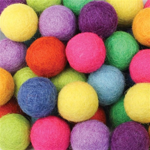 Colorful felt balls in various bright colors arranged in a group