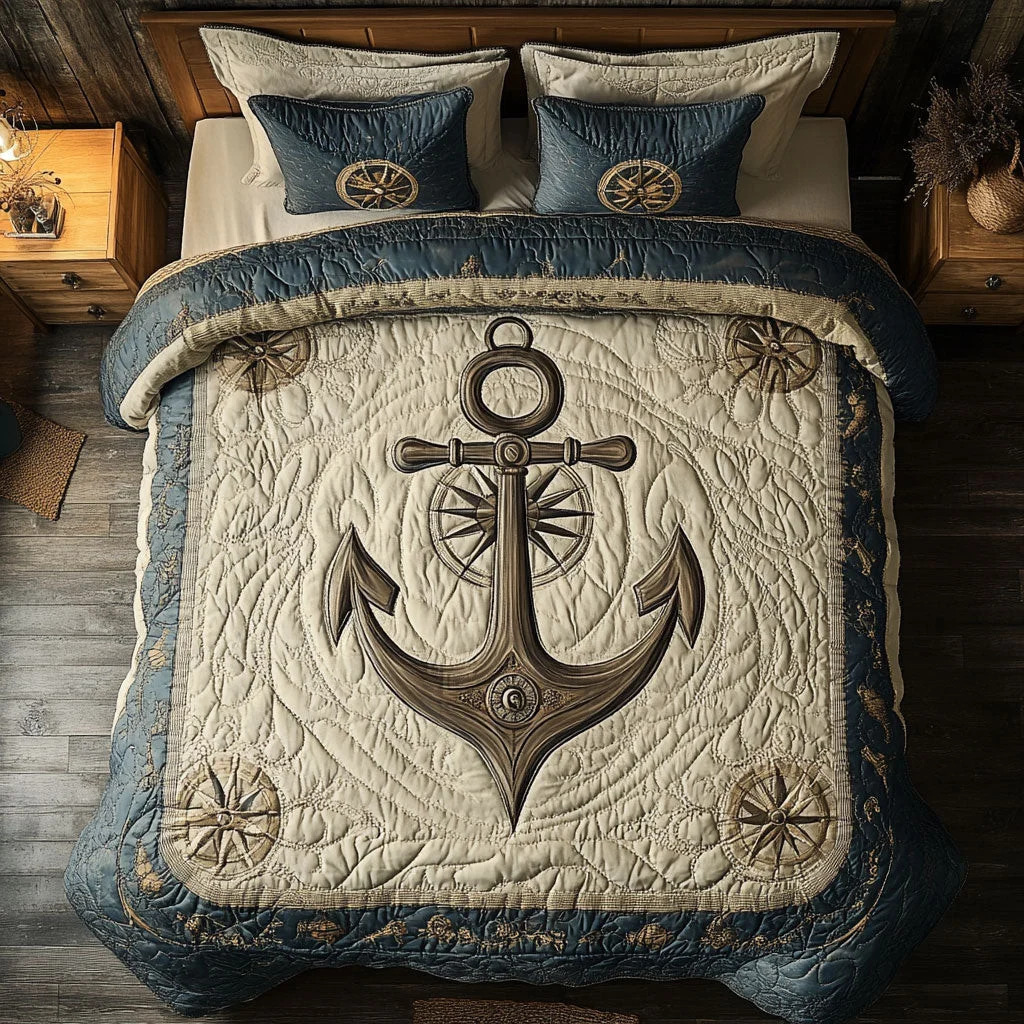 Overhead view of a bed with a blue and beige quilt featuring a large anchor design